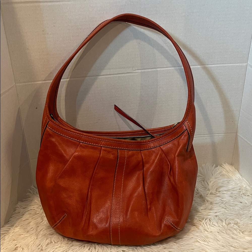 Coach Ergo vintage burnt orange leather pleated hobo shoulder bag.